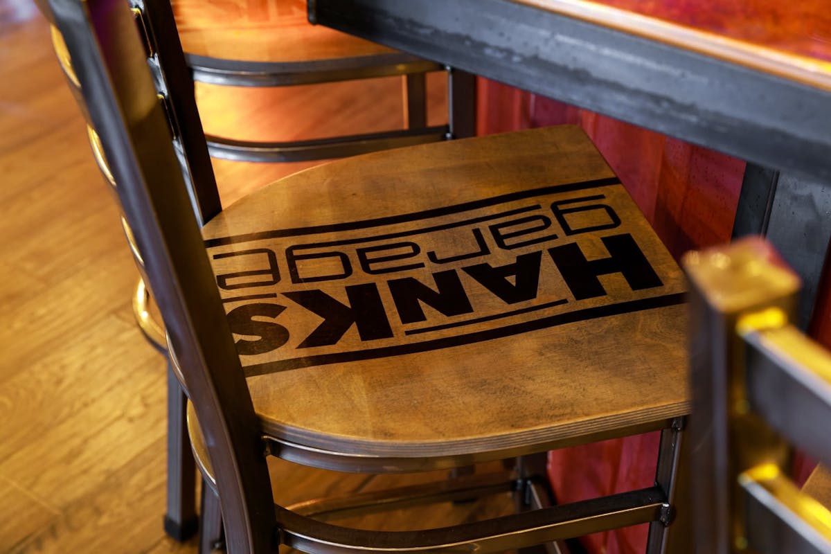 Branded high top bar stools at Hanks Garage Venue
